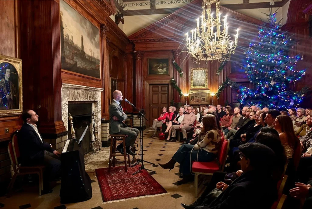 Angel-voiced Oliver Darley and virtuoso pianist Chad Lelong sing Christmas songs in Knebworth House's  Jacobean Banqueting Hall, beautifully decorated for Christmas.